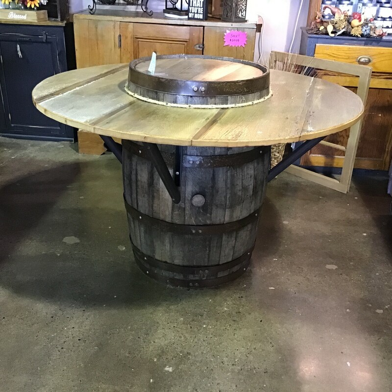 This super cool table was made by one of our local artists using an old barrel and reclaimed barn wood. It has black metal brackets underneath for support and the top of the barrel comes through the top of the table and would be perfect for your serving pieces! This piece is an awesome conversation piece and is one-of-a-kind!
Dimensions are 52 in x 31 in