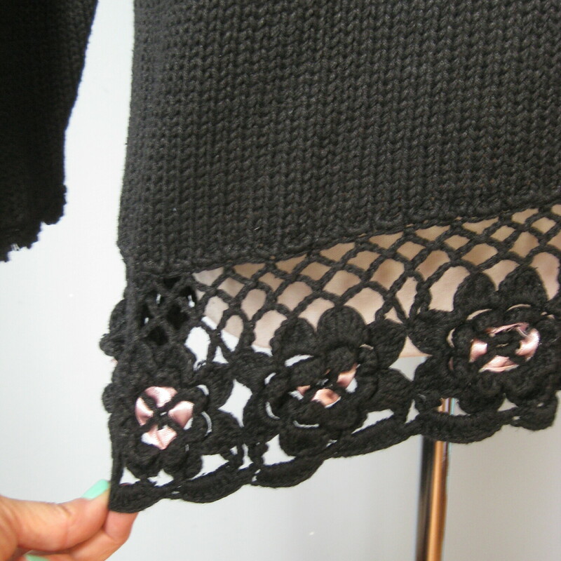 Vtg New Concepts Ribbons, Black, Size: Medium<br />
<br />
Long cozy and girly black sweater with lush pastel floral ribbon and pearl embroidery on the front and an intricate crocheted hem.<br />
by New Concepts  made of a cotton ramie blend.<br />
Shoulder pads<br />
<br />
<br />
Marked size M<br />
flat measurements:<br />
Dropped Shoulder to shoulder seam: 21.5<br />
armpit to armpit: 22<br />
width at hem: 21<br />
length: 30<br />
underarm sleeve seams: 17<br />
<br />
thanks for looking!<br />
#43203