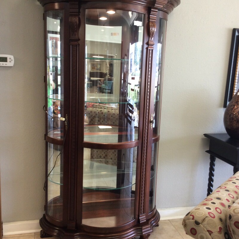 This is a bautiful brown Reinisch Co Curio Cabinet. This cabinet has 2 glass doors, 4 glass shelfs and 1 overhead light.
