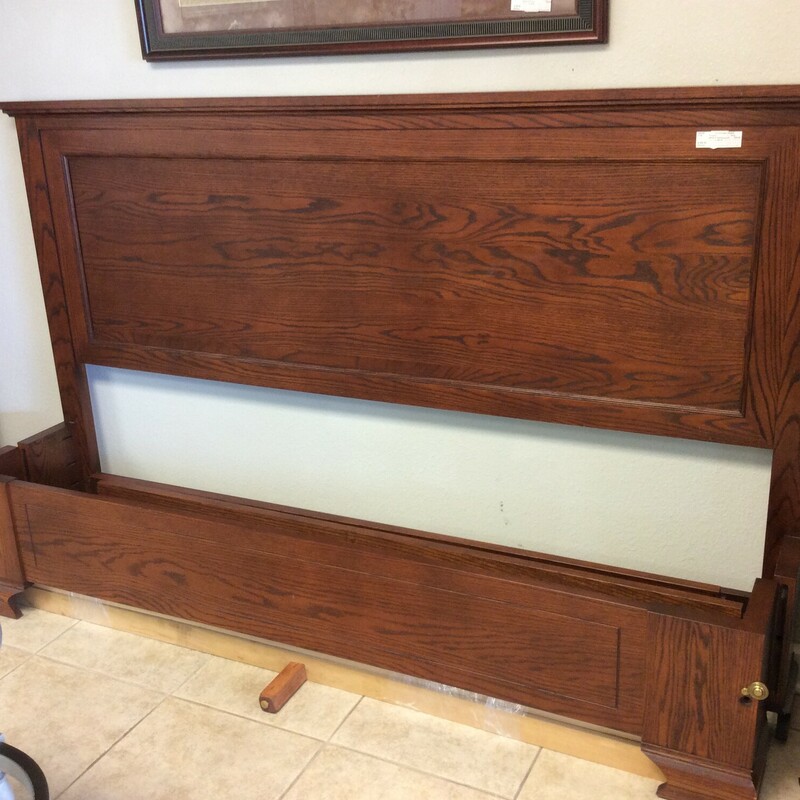 This is a beautiful reddish-brown wood King Headboard and Footboard. This Set comes with rails and supports.