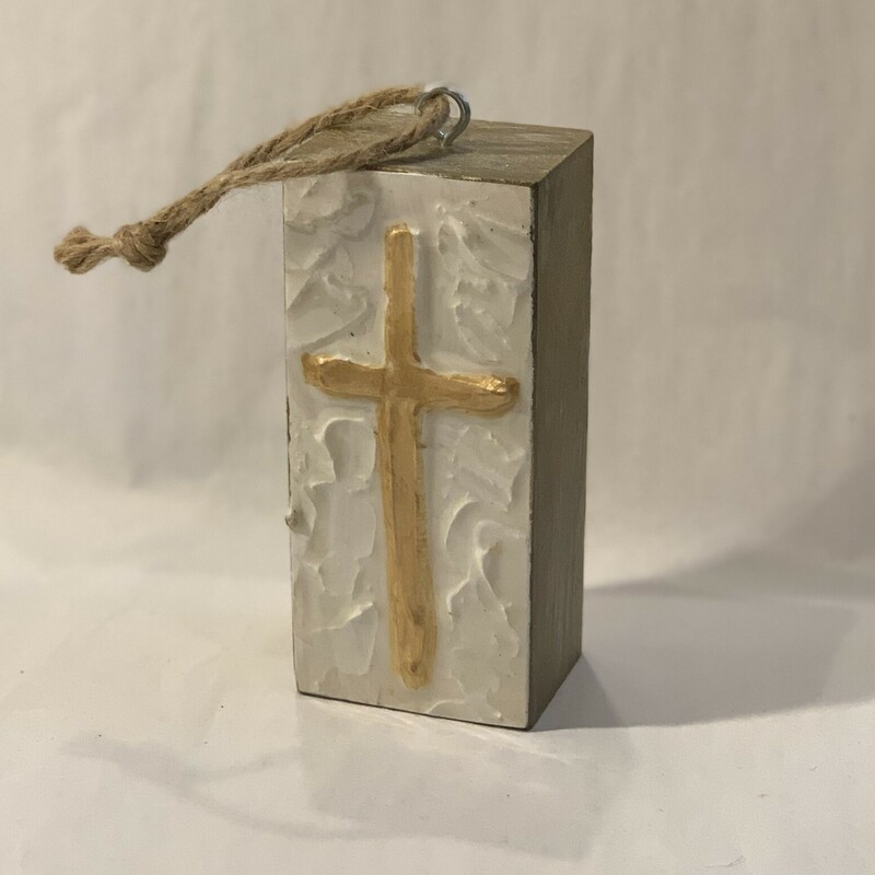 This beautiful cross ornament is made of wood with a glossy, textured paint coating. It measures 4.5 inches tall, 2 inches wide, and 1.5 inches deep.