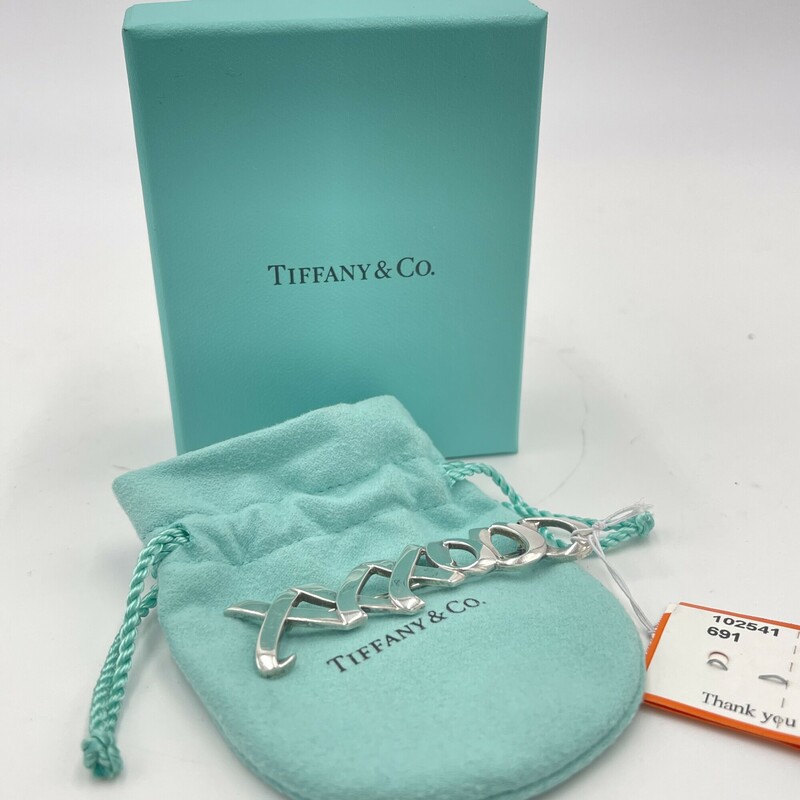 Tiffany & Co. Sterling Silver Paloma Picasso Pin, XXXOOO. Includes box + bag.<br />
Size: 3in