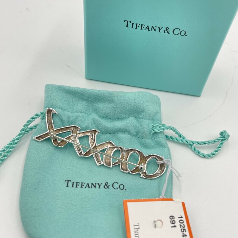 Tiffany & Co. Sterling Silver Paloma Picasso Pin, XXXOOO. Includes box + bag.<br />
Size: 3in