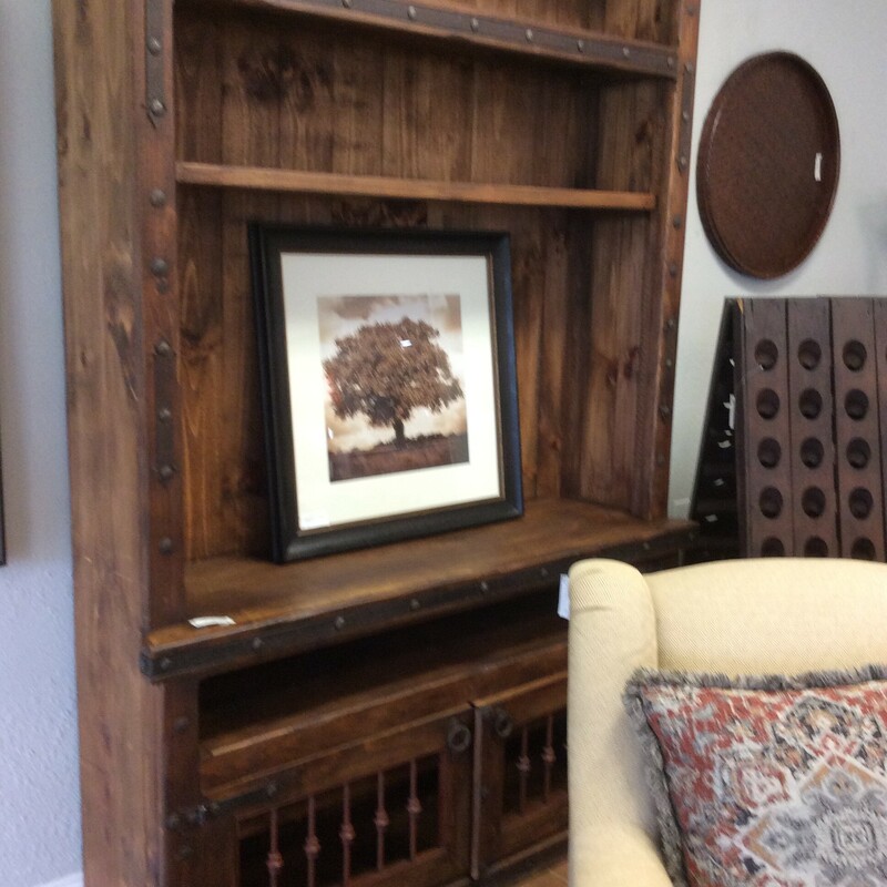 This multi use, rustic, pine cabinet has a dark stain with iron accents. Could be used as a bar or TV cabinet.
