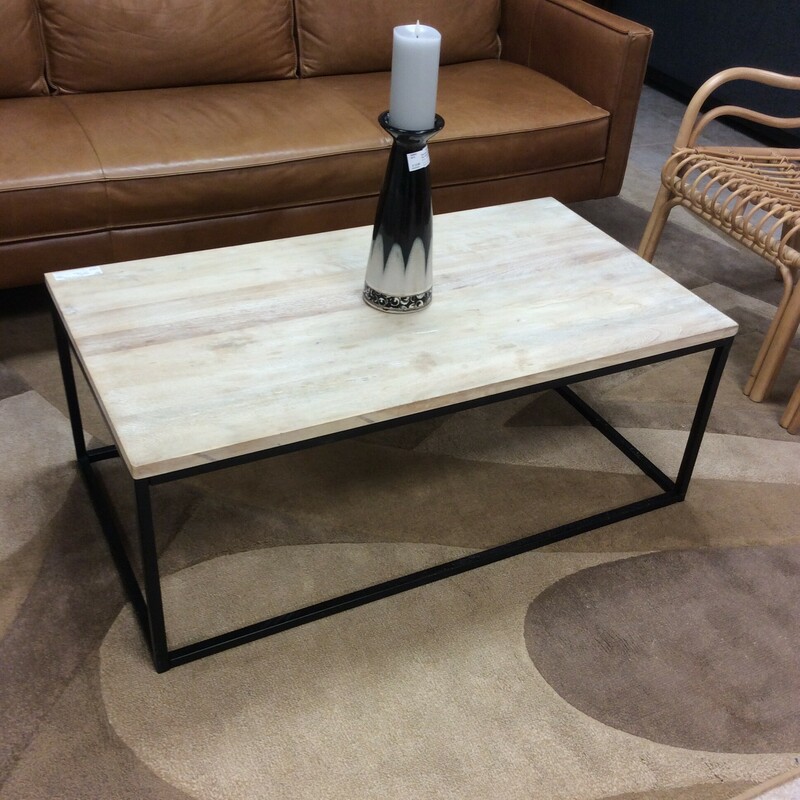 This is a beautiful metal and wood coffee table.