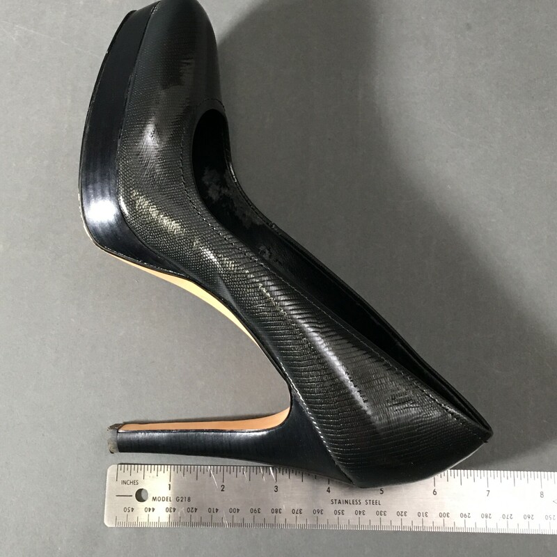Platform pump heelsTextured dark grey patent leather upper, 3/4\" platform 4.5\" wood stack cone heel in Black, Size: 9 Pre Owned, interior shows some wear,  good exterior condition, Calvin Klein heels.<br />
1lb 6.6 oz<br />
LUB<br />
FB