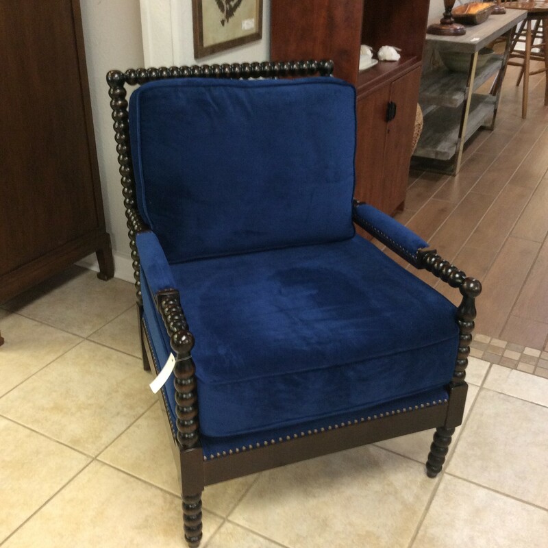 This is a beautiful black spindle frame arm chair. This chair has a electric blue, linen seat and arm rest wil nail head trim.