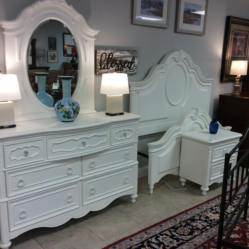 This is a beautiful, white 3 piece Room Gear Twin bedroom suit. This set is completed with a 7 drawers dresser and mirror, a 2 drawer night stand and a Twin headboard and footboard.