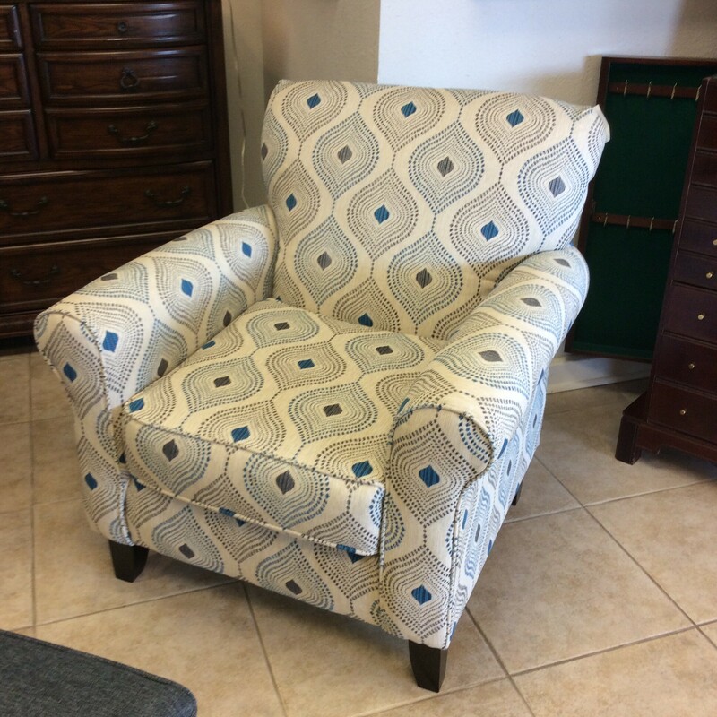 This is a blue,gray and white Fushion Chair with a peacock design.