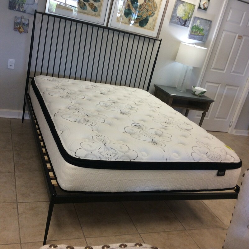 This is a Black Metal West Elm Queen Bed with frame and mattress.
