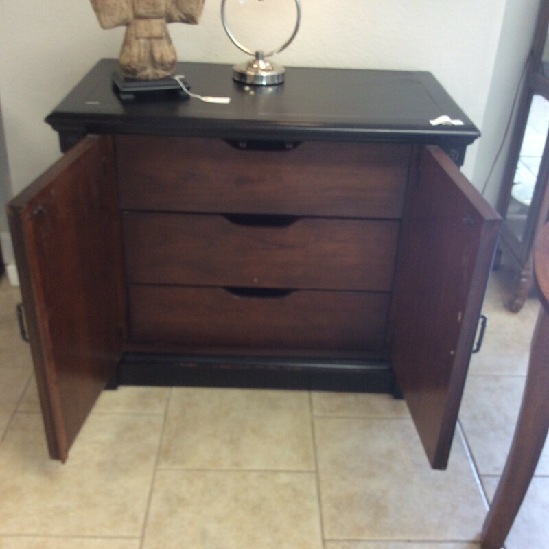This is a black, 3 drawer, Stanley Console Cabinet.