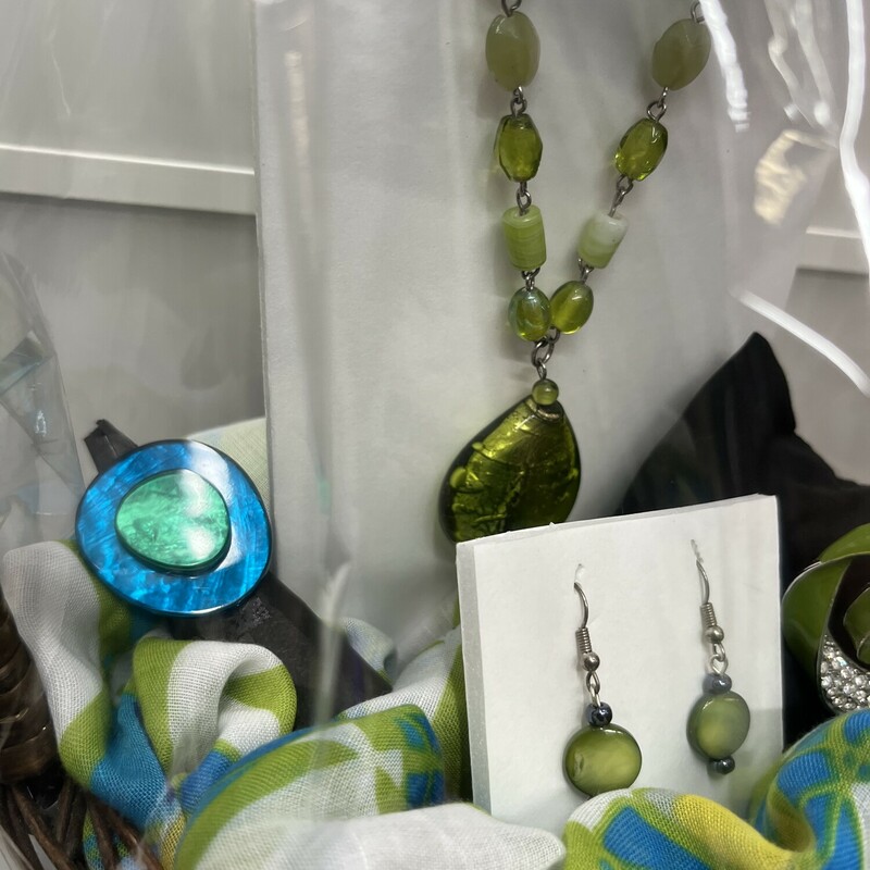 This Custom Made $70 Value Gift Basket comes with A Green Beaded Necklace & Earring Set,
Green and Aqua Scarf,
Matching Ring and Brooch
All Brand New Items pulled together Beautifully in a Brown Basket Ready to Gift to someone special! Local Delivery is available upon request.