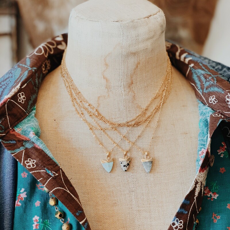 These gorgeous arrowhead necklaces come in three different colors: Stone Gray, Robbins Egg Blue, and Speckled Cream.

The necklace is 15.5 inches in length with a 2.5 inch extender