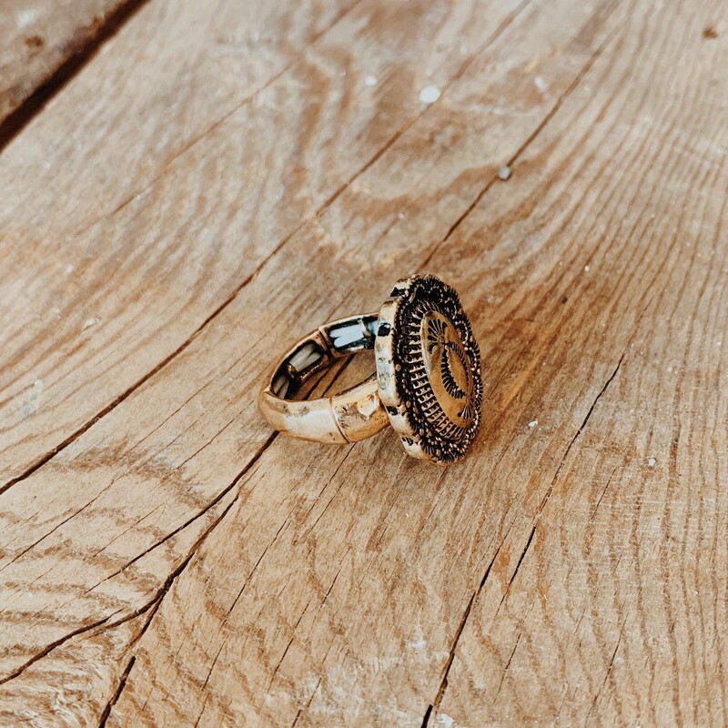 This brass, oval shaped ring is on a stretchy band for flexible sizing!