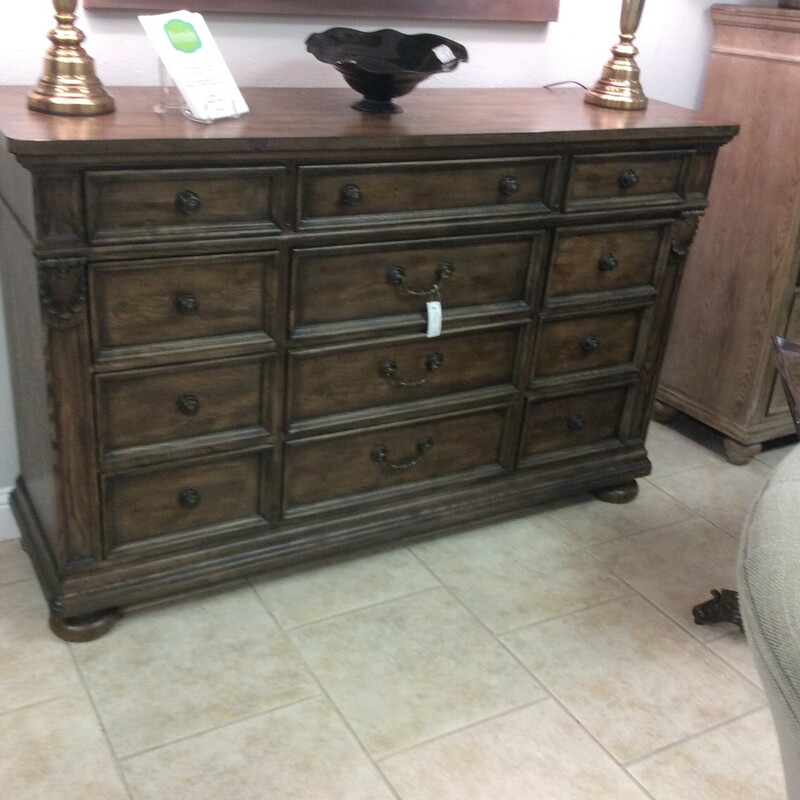 This twelve drawer dresser from Haverty  has loads of storage and is done in a dark wood finish.