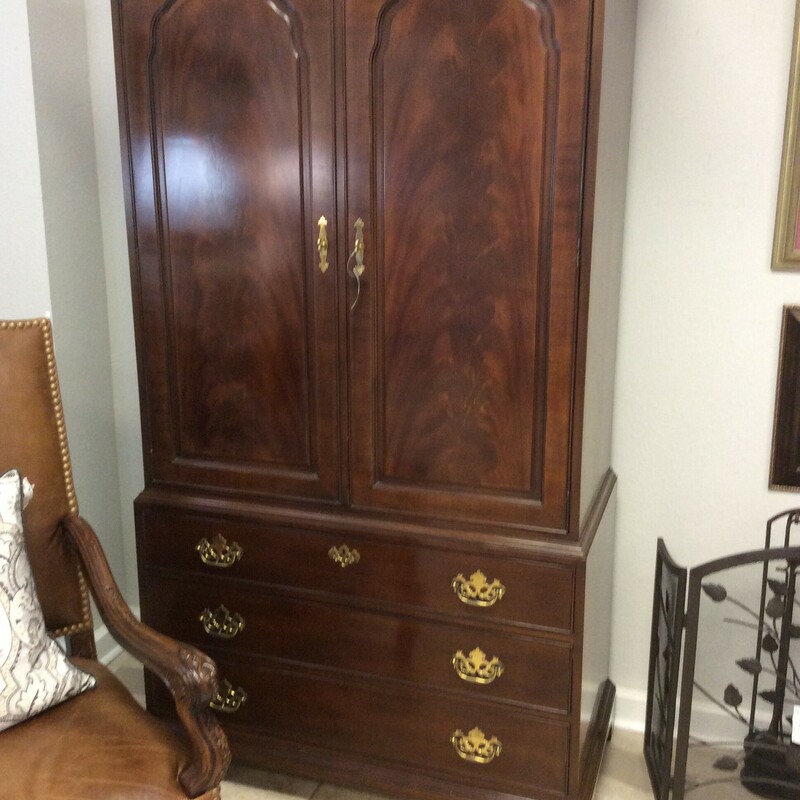 This traditional style armoire from Drexel is done in a dark cherry finish.