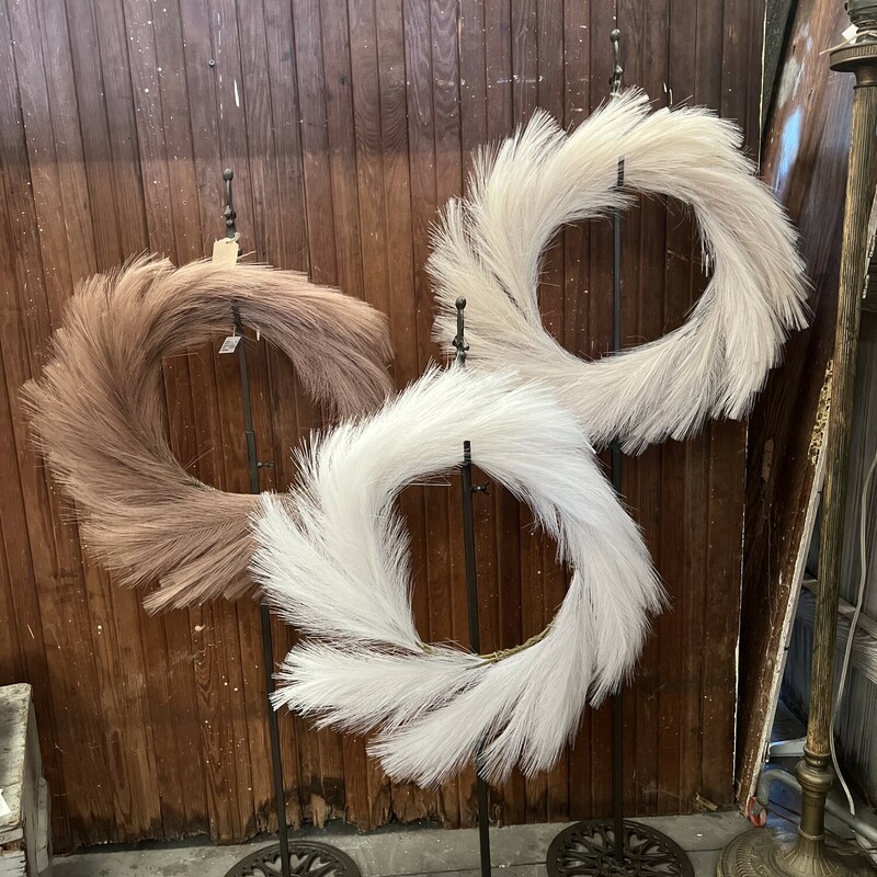 Our pampas wreaths are a beautiful mix of glamour and simplicity! They are feathered faux pampas grass stems and measures 24 inches. They look gorgeous hanging or lay them flat and fill the center with pumpkins, candles, or small dough bowl.