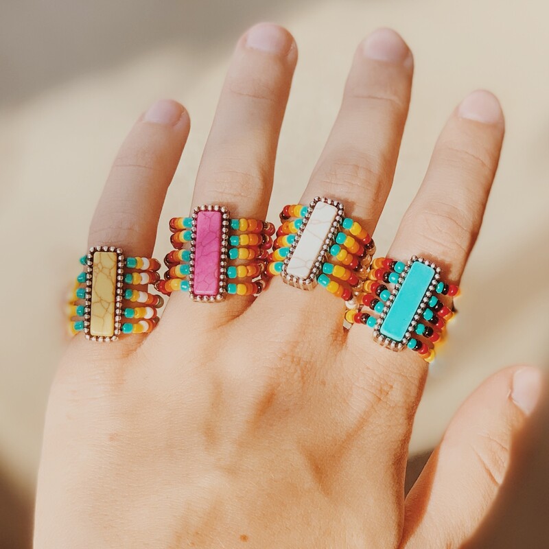 These colorful seed bead rings are on a stretchy band for multiple size wear! These rings are available in white, pink, blue, or yellow!