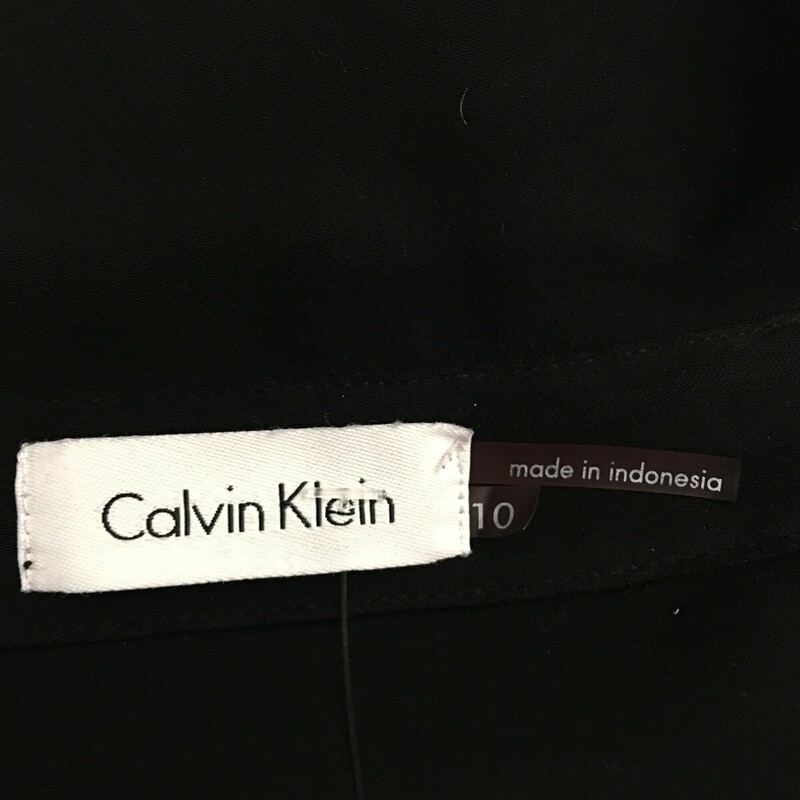 Calvin Klein Zip Shirt, Black, Size: 10<br />
Up down gold front zip, gold snap closure fron breast pockets, adjustable gold snap 3/4 sleeves, cute tie as belt or necktie, 100% polyester.Dry clean only.<br />
1 lb 1.1 oz
