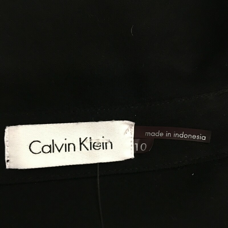 Calvin Klein Zip Shirt, Black, Size: 10
Up down gold front zip, gold snap closure fron breast pockets, adjustable gold snap 3/4 sleeves, cute tie as belt or necktie, 100% polyester.Dry clean only.
1 lb 1.1 oz