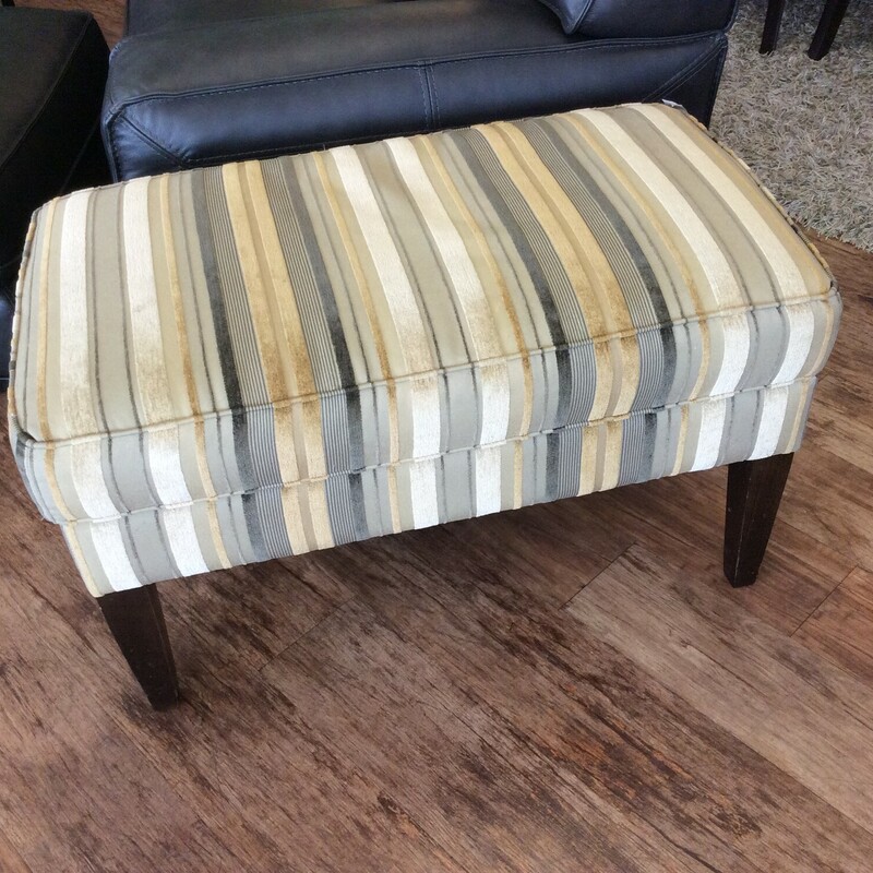 This is a beautiful blue, gold and cream stripped Bassett Ottoman.