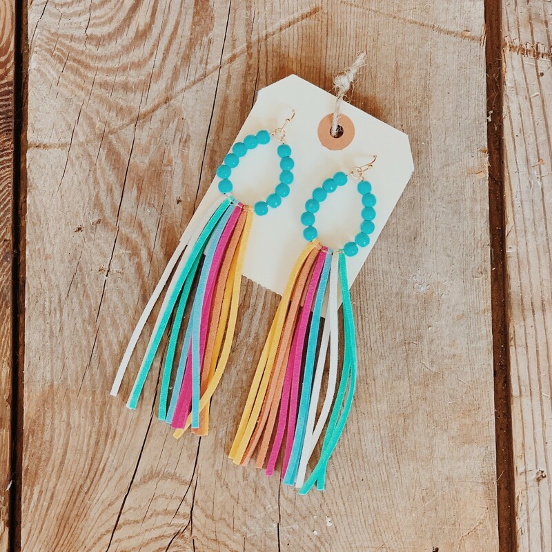 These beautiful tassel earrings are available in pink, tan, rainbow, or black! They measure 5 inches in length.