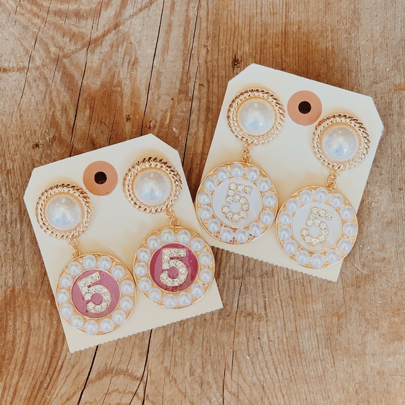 These fun earrings are bedazzled in faux pearls and rhinestones and have the number 5 on them! They measure 2.5 inches in length and are available in white or pink.