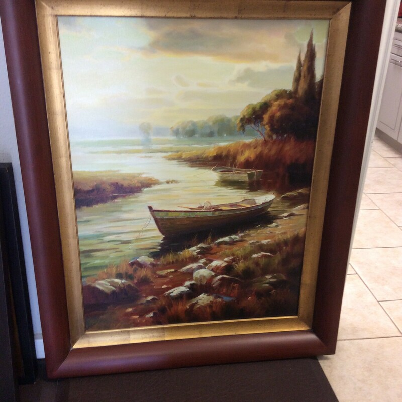 This handsome Oil On Canvas water scene with boats is beautifully painted and framed in a complementary wood frame,