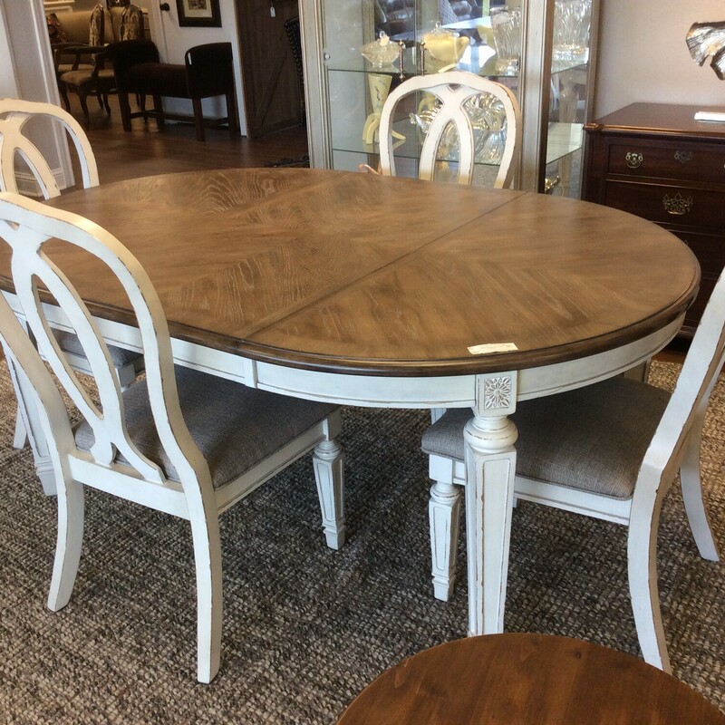 This is a beautiful white distressed oval table with 1 leaf and 4 chairs.