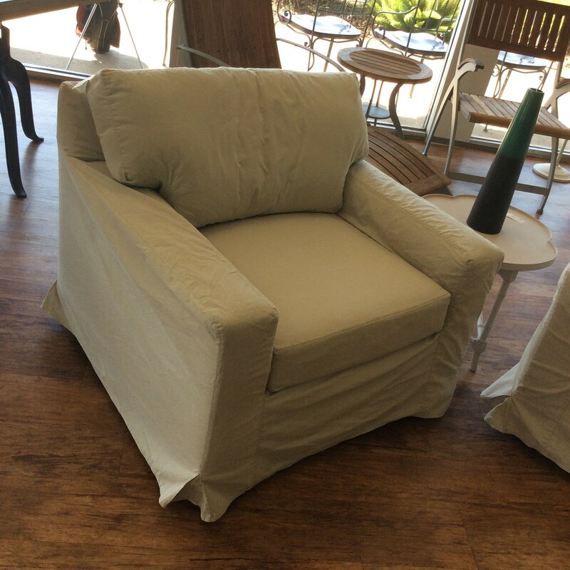 This is a beautiful, white slip covered oversized chair.