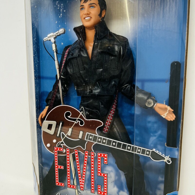 Vintage Elvis Presley 30th anniversary doll.<br />
<br />
A true vintage!<br />
<br />
Celebrating the 30th anniversary of his 1968 television special!<br />
<br />
Elvis is wearing a black leather motorcycle jacket, black leather pants, black biker boots, a silver watch, and a red Gibson electric guitar.<br />
<br />
Comes with a shiny silver microphone and stand.<br />
<br />
From the Elvis Presley Collection, first in the series.<br />
<br />
Comes in the original box.<br />
<br />
There is minor wear and tear on the box.<br />
<br />
8in wide x 13 1/2in tall
