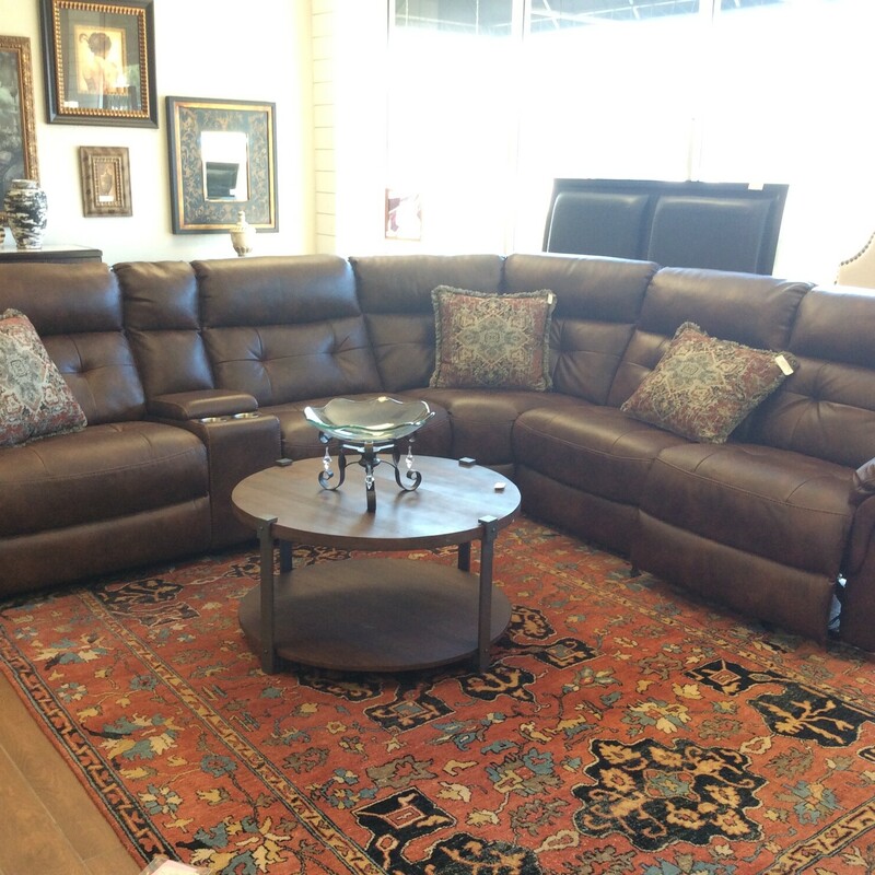 This is a nice electric, brown sectional sofa.