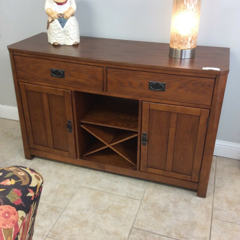 This is a beautiful wood mission style buffett with 2 cabinets, 2 drawers and a wine cubbie.