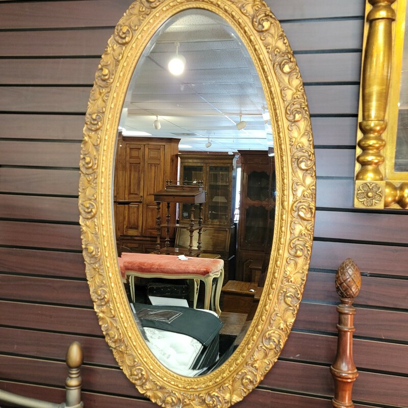 Guilded Framed Oval Mirror w/ Beveled Edges. .  Fabulous frame!  Can be hung horizontally or vertically.  Measures 24' wide; 44' tall.