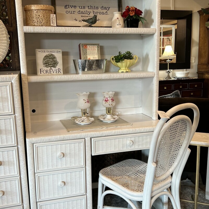 White wicker desk and chair set.

Crisp white woven wicker desk hutch with a cute white wicker chair.

The desk has 1 narrow drawer and 3 side bottom drawers.

There is minor wear on the desk and chair.

Desk: 40in wide x 18in deep x 76 1/2in tall
Chair: 16in wide x 39in tall x 18in deep x 19in tall (seat to floor)