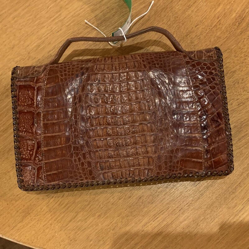 Vtg Alligator Purse
 Size: 9 x 5 x 1
Incredible vintage alligator purse in very good condition.  Leather and stitching are all intact.  The snap and zipper are in good working order.  It is in fantastic  condition for its age; probably from the early 1950s.
