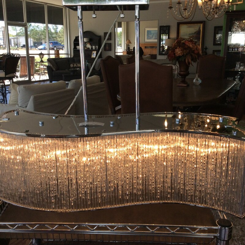 This is a beautiful, crystal wave chandelier with a silver base.