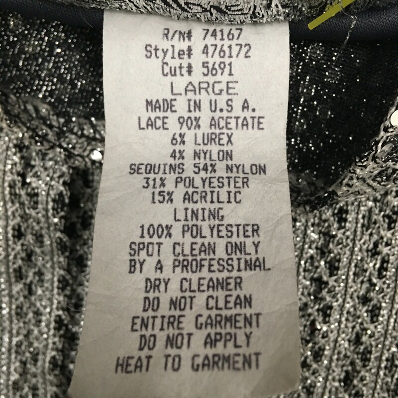 Sharade Nites Knit, Silver, Size: Large Womens<br />
Vintage 2 piece metalic silver and black knit with silver sequins sweater set, Sleeveless tank,  long sleeved open front cardigan with single collar button. Very nice condition. Acrylic blend<br />
11.5 oz