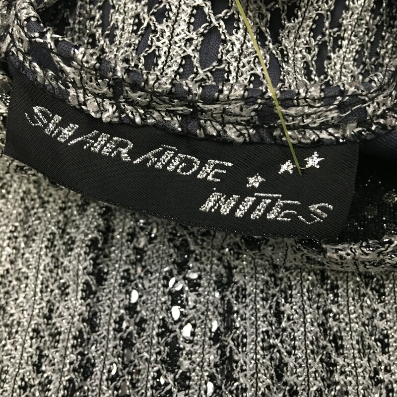 Sharade Nites Knit, Silver, Size: Large Womens<br />
Vintage 2 piece metalic silver and black knit with silver sequins sweater set, Sleeveless tank,  long sleeved open front cardigan with single collar button. Very nice condition. Acrylic blend<br />
11.5 oz