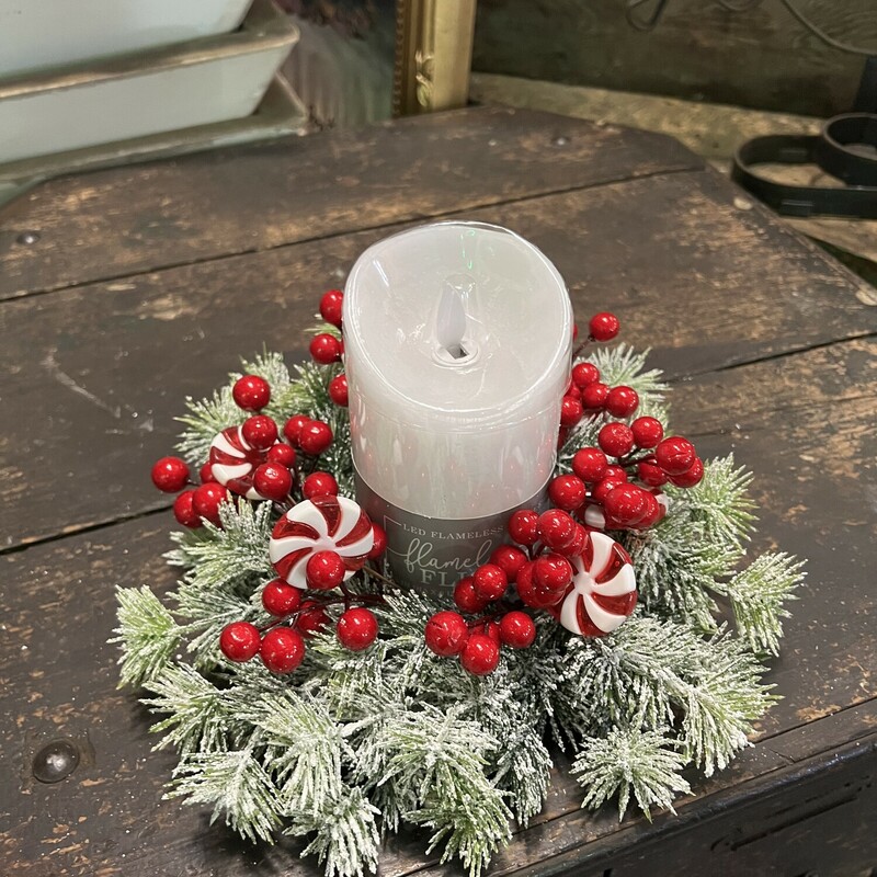 This fun candle ring will add a touch of whimsy to your holiday decor. Ring has a mixture of berries, peppermint candy and snowy greenery.  Ring measures 10 inches in diameter with a 3 inch inner
Our flicker candles fit perfect in the ring and you can find them in our home decor section