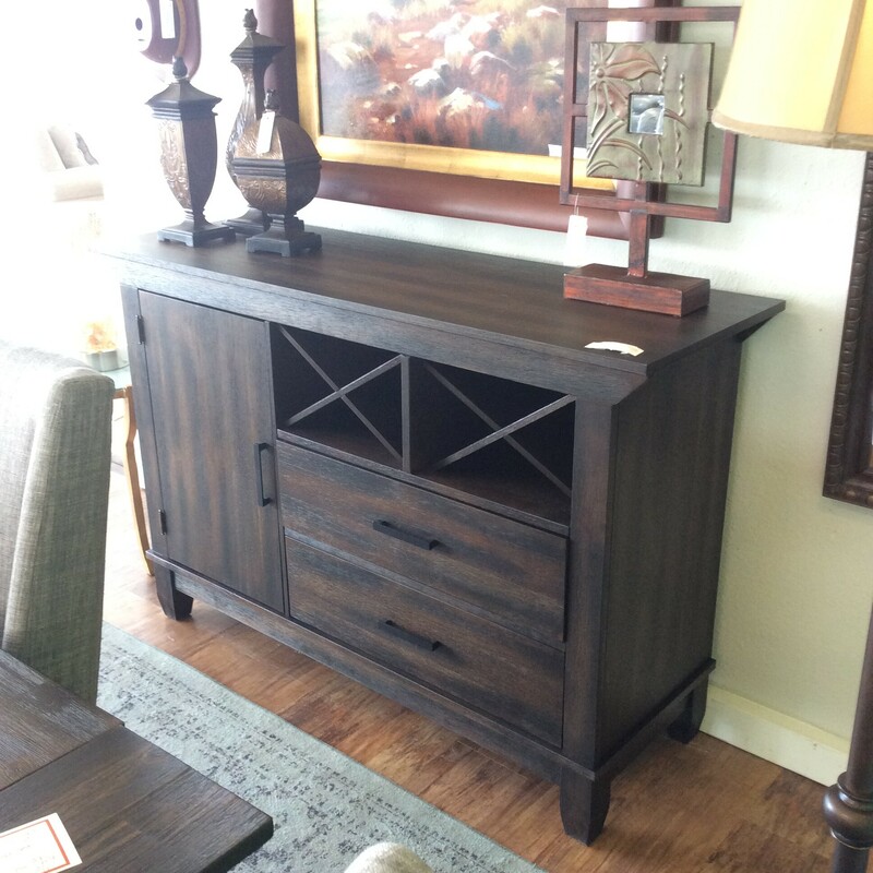This  Buffet by Liberty has wine storage and is done in a rustic darkwoog finish.