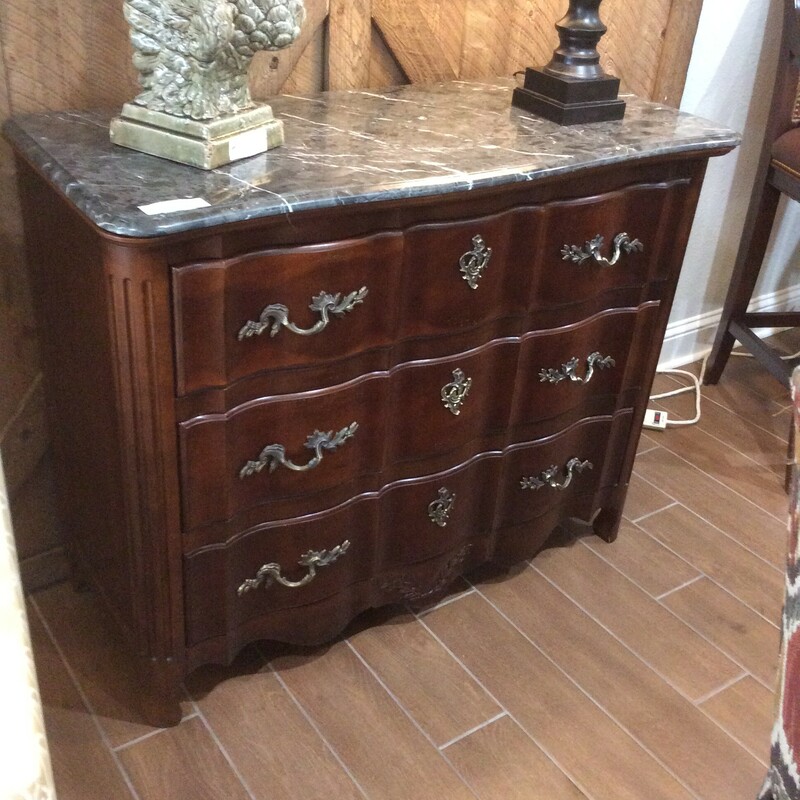 This is a beautiful 3 drawer, cherry wood, marble top dreser.