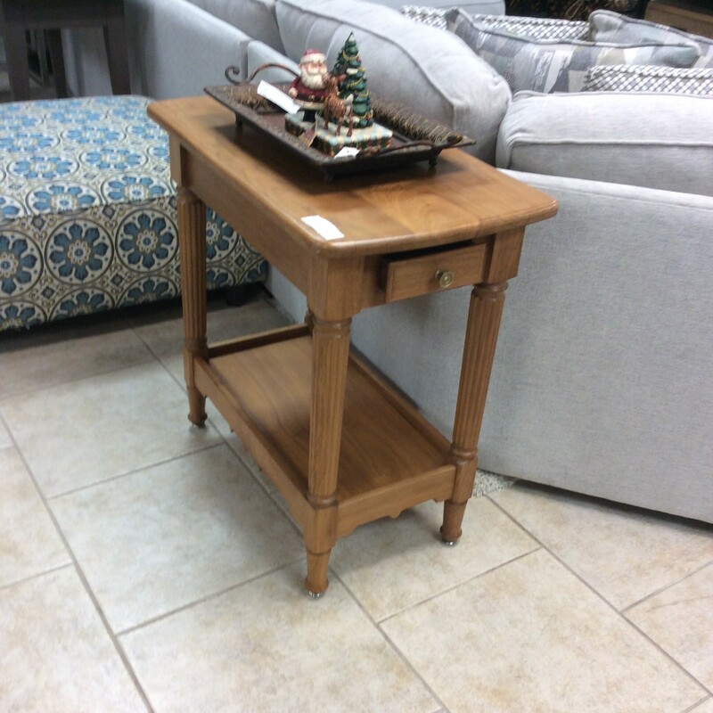 This is a light wood, 1 drawer, Fred Tinker Side Table.
