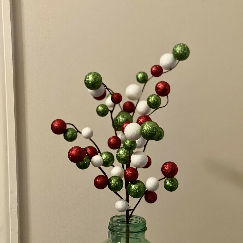 This fun and festive glitter ball pick witll surely add some whimsy to your holiday decor. A mixture of green, red and white glitter balls on a brown floral wrapped stem measuring 17 inches tall.
