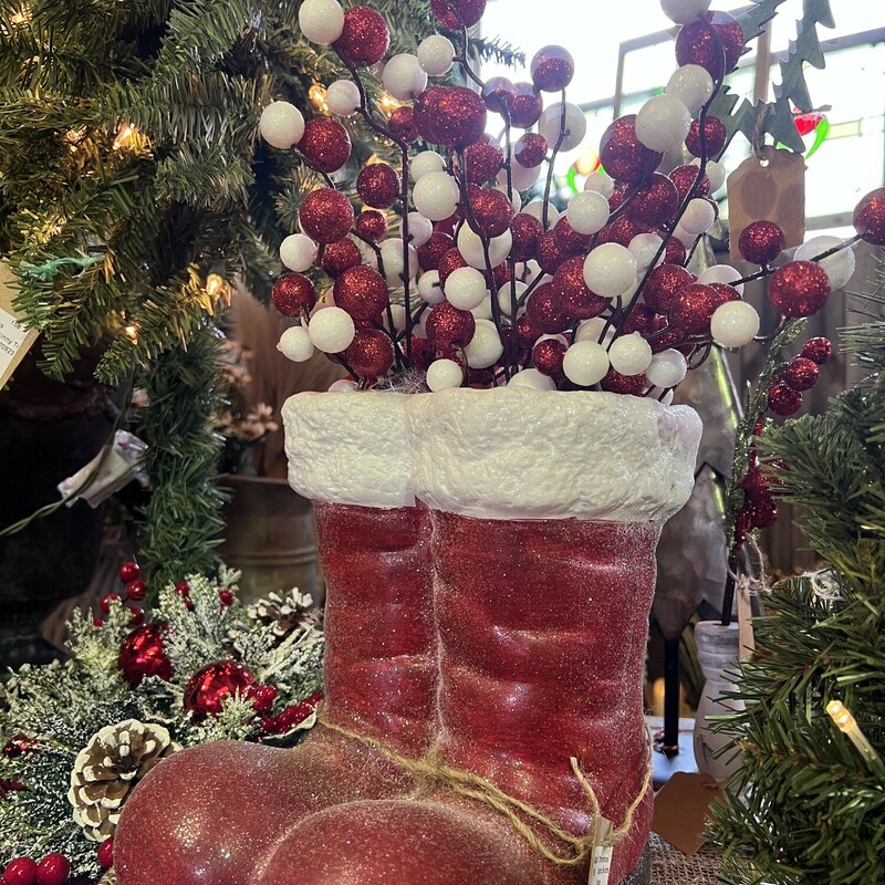 The Santa Boots Planter is heavily glittered painted terra cotta container which makes it perfect with any holiday decor. Just about any grouping of florals from greenery to glittered stems look beautiful in this planter