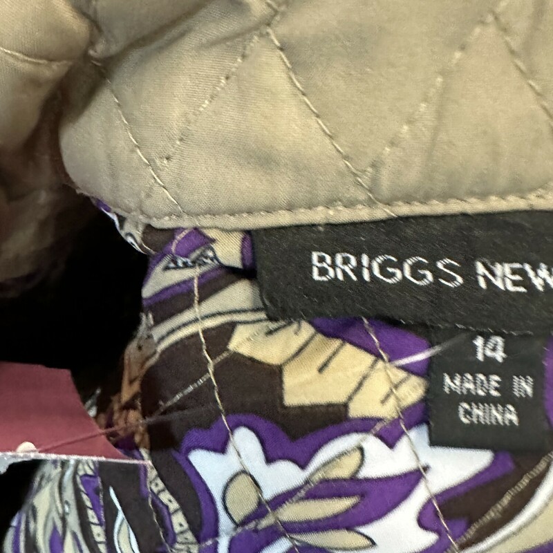 Lightweight quilted jacket with purple paisley lining. Snap closure.