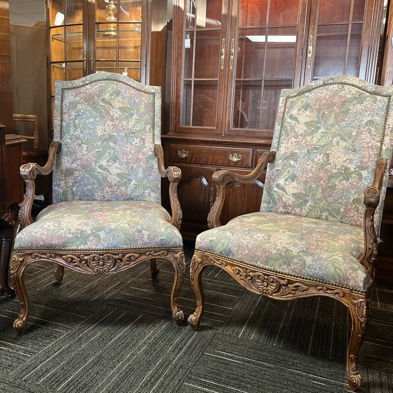 Floral print French chairs with carved wood arms and legs; in good condition with finish wear on arms and legs. Seat height of each is 20.5 inches. Each measures 28.5 in. wide and back height is 30 inches.