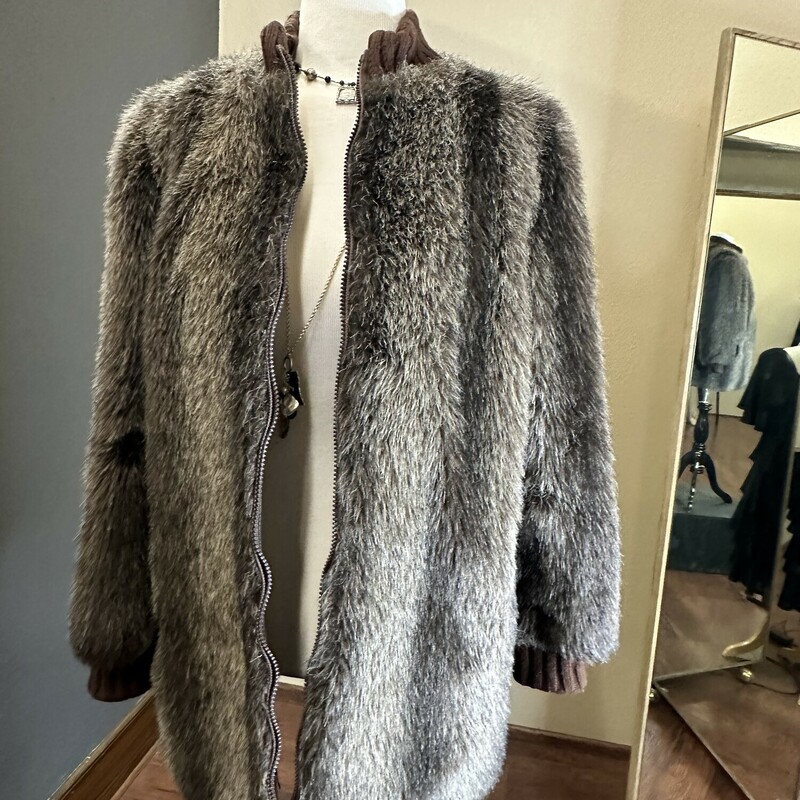 This jacket is going to be the most unique thing in your closet this season! In a size large for 64.99, this fuzzy authetic jacket will get you all the compliments this season!