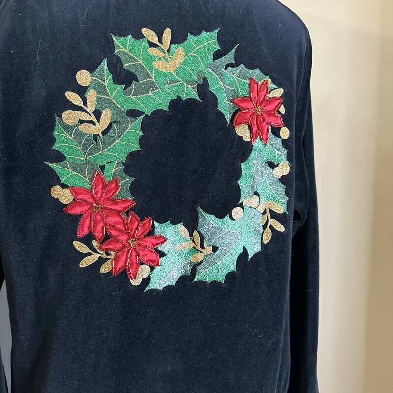 This velvet, vintage, holiday zip up is the perfect thing to throw over this holiday season! In a size large for 17.99, this zip up is what you need to keep warm this holiday season!