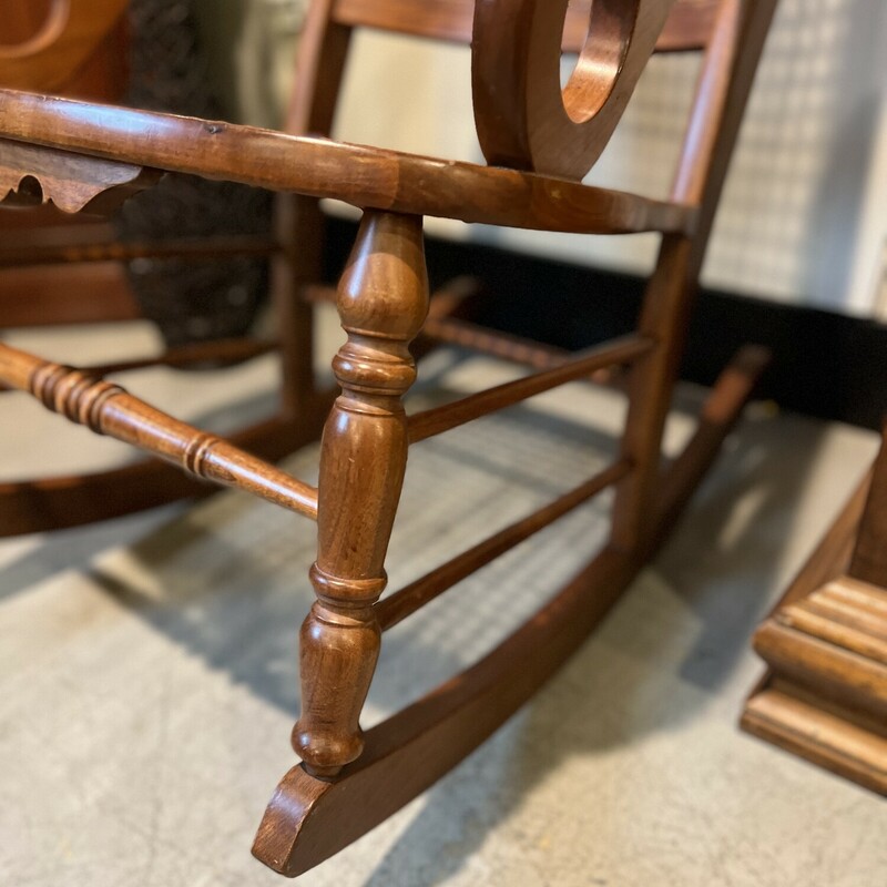 Amana cain wood rocker.<br />
<br />
Beautifully carved medium wood Amana rocker chair with a wicker cain seat and and back rest.<br />
<br />
Comes with Amana furntiure polish.<br />
<br />
There is minor wear on the wood.<br />
<br />
41in tall x 22in wide x 32in deep x 18in tall (seat to floor)
